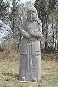 Song tomb guardian in lamellar armour holding an axe