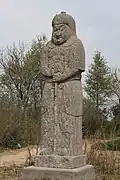 Song tomb guardian in cord and plaque and lamellar armour, holding an axe