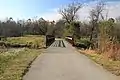 Bridge and path over the DuPage River in the Winfield Mounds Forest Preserve