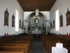 Interior of Church from front door. The altar is straight ahead.