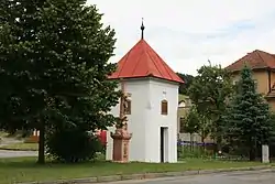 Belfry and a cross in the centre of Závist