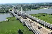 Zaltbommel (in the upper right-hand corner of the image) is situated on the banks of the Waal. Major north–south highways and railways cross the river in the town, just east of the town centre.