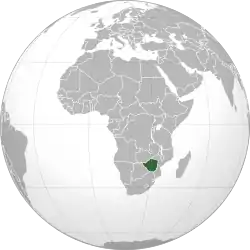 An orthographic projection of the world, centred on the Congo. Political borders are marked. Rhodesia (modern Zimbabwe) is highlighted in green.