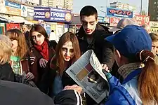 Yulia Mykytenko takes part in a theatralized "zombie-demonstration" against the "Vesti" newspaper, which was thought by activists to be engaged in anti-Ukrainian propaganda, April 2015 (second from the left, in a red scarf).