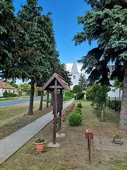 The main street of the village with the bell tower