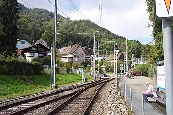 Looking uphill towards the Uetliberg with the level crossing of Hohensteinweg