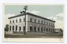 Old-fashioned postcard of a large government building.