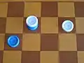 5. Blue piece jumped over "column" and moves into the kings row on the opposing player's side of the board.  That piece becoming a "king" and jump over and hence capture an white piece.