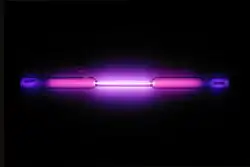 Vial containing a violet glowing gas