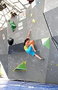 caption=Climber in a bouldering competition