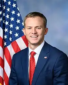 Upper-body portrait of a twentyfirst-century man in a suit.