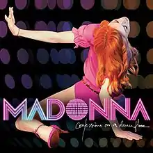 Back of a woman with fiery red hair and wearing a pink leotard. Her legs are stretched apart and she wears pink shoes with heels. Her left hand is stretched right out and she tilts her head back while supporting herself with her right hand. The backdrop reveals small colored circles like a disco ball. On the image, the word "Madonna" is written in capital pink-and-white stripes. Beneath it, "Confessions on a Dance Floor" is written in white flowing script.