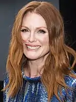 Julianne Moore at the 2014 Toronto International Film Festival, looking to the front and smiling