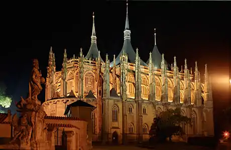 Church of St Barbara, a large Gothic building, at night