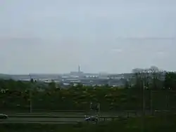 In sight are the M2, Rochester Bridge and Castle, the covered slips at Chatham Dockyard, Kingsnorth Power station and in the far distance the Grain Power Stations