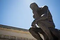 Statue of The Thinker by Auguste Rodin in the front of the museum.