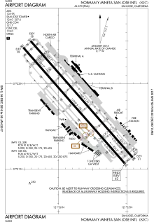 A map with a grid overlay showing the terminals, runways, and other structures of the airport.