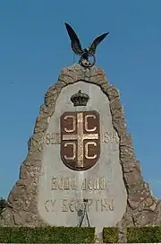 A large stone monument topped by an eagle.