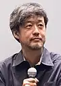 A photograph of Takashi Yamazaki at the Yebisu Garden Cinema in 2018