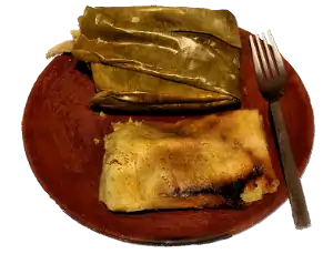 tamales on a wooden plate