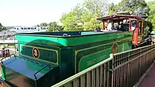 The back of a locomotive tender with the inside of the locomotive's cab partially visible