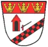 A shield, in the main white, with a red top border containing three crowns. At the centre, a red tollhouse and a line checkered in red and black.