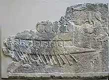 WA 124772: An Assyrian warship carved into stone (700–692 BC) from the reign of Sennacherib. Ninevah, South-West Palace, Room VII, Panel 11. British Museum.