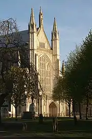 Gothic-style cathedral, seen through trees